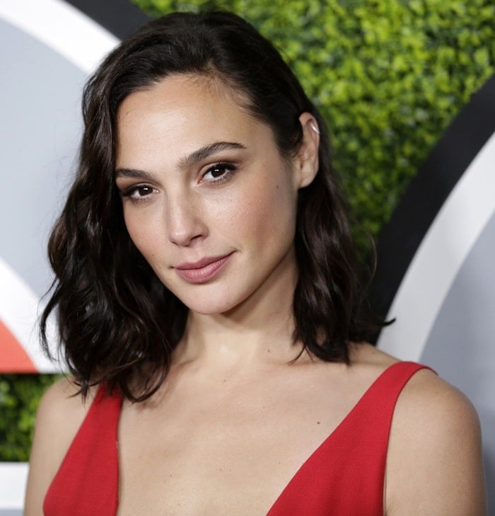 Gal Gadot strikes a pose as she arrives in a red Dior dress at the 2017 GQ Men of the Year Dinner hosted by GQ and Dior Homme at the Chateau Marmont in Los Angeles on December 7, 2017