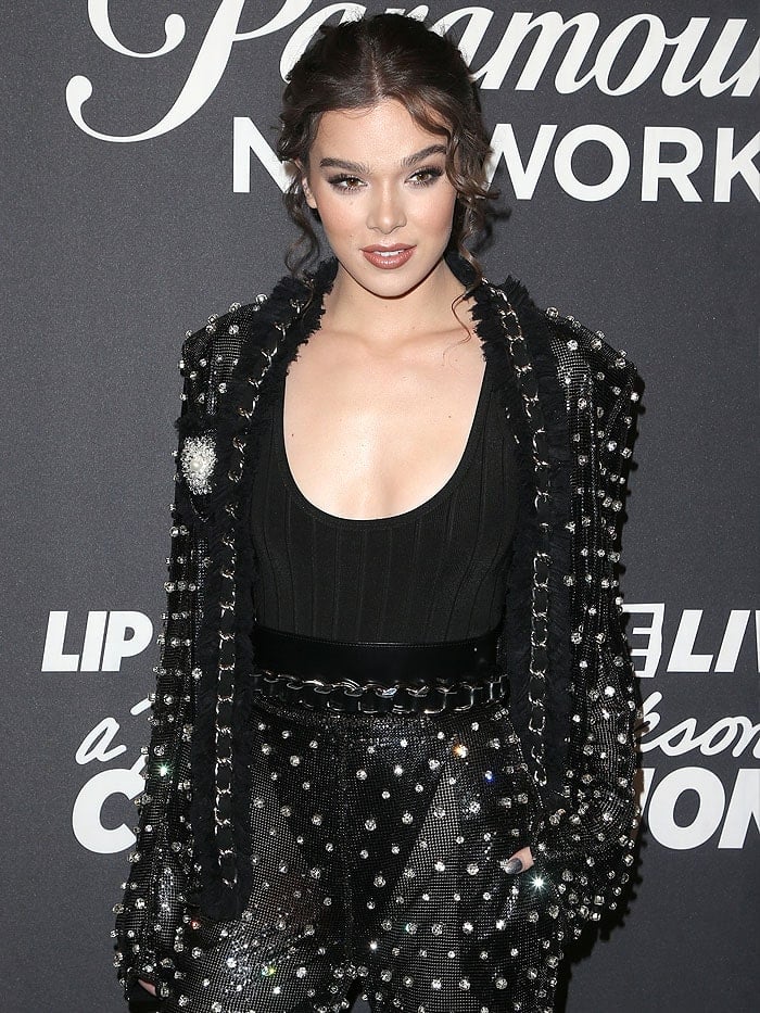 Hailee Steinfeld a black bodysuit with high-cut bottoms that were exposed through her ensemble's sheer fabric