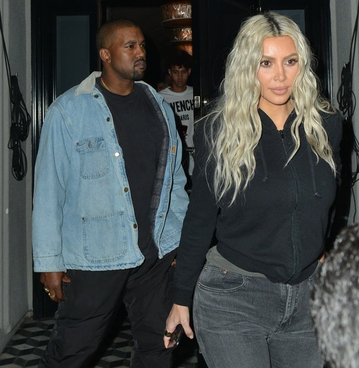 Kim Kardashian and Kanye West make their way out of Craig’s restaurant in West Hollywood, California, on January 12, 2018