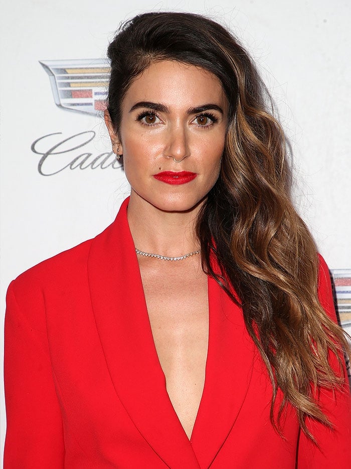 Nikki Reed wore her hair in a sideswept and slicked-down style that perfectly showed off her diamond earrings and the exquisite gold-and-diamond necklace at her collarbone