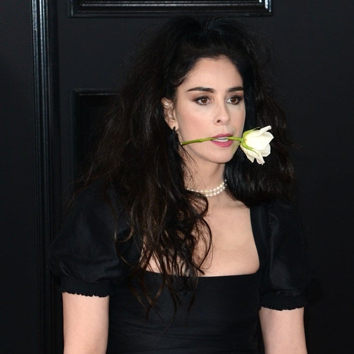 Sarah Silverman carried a white rose in her mouth