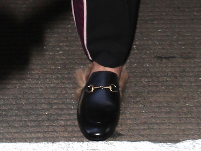Sharon Stone's choice of footwear for travel: the Gucci 'Princetown' fur-trimmed leather slippers.