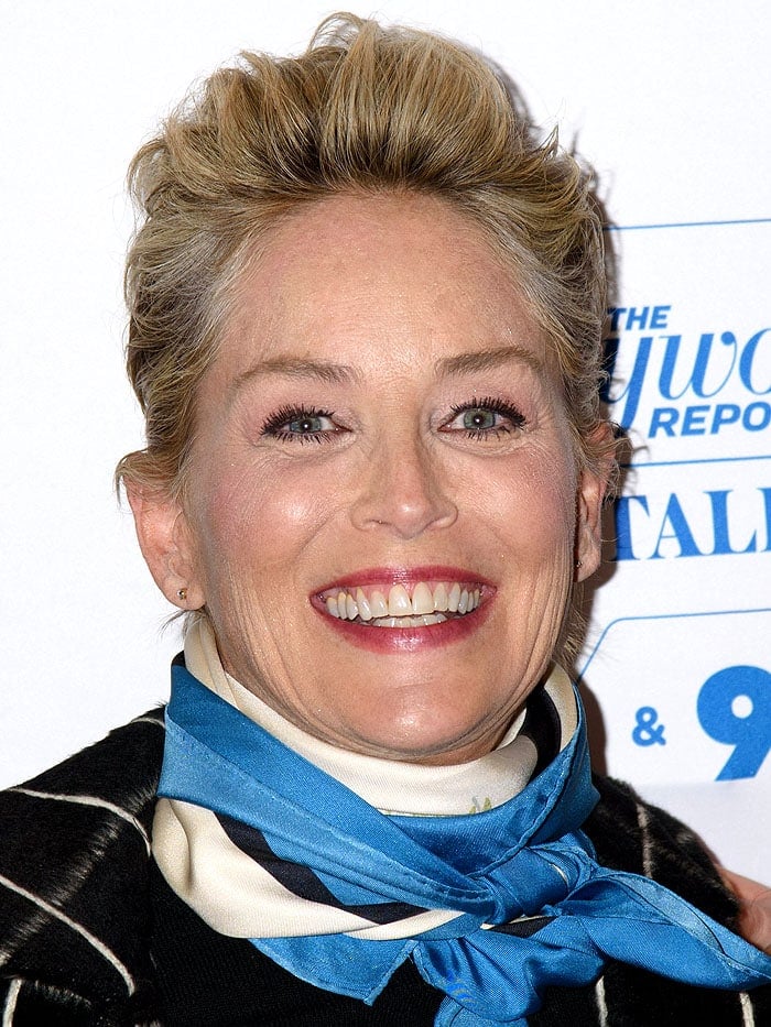Sharon Stone topped everything off with a blue-white-and-navy satin scarf tied tightly around her neck