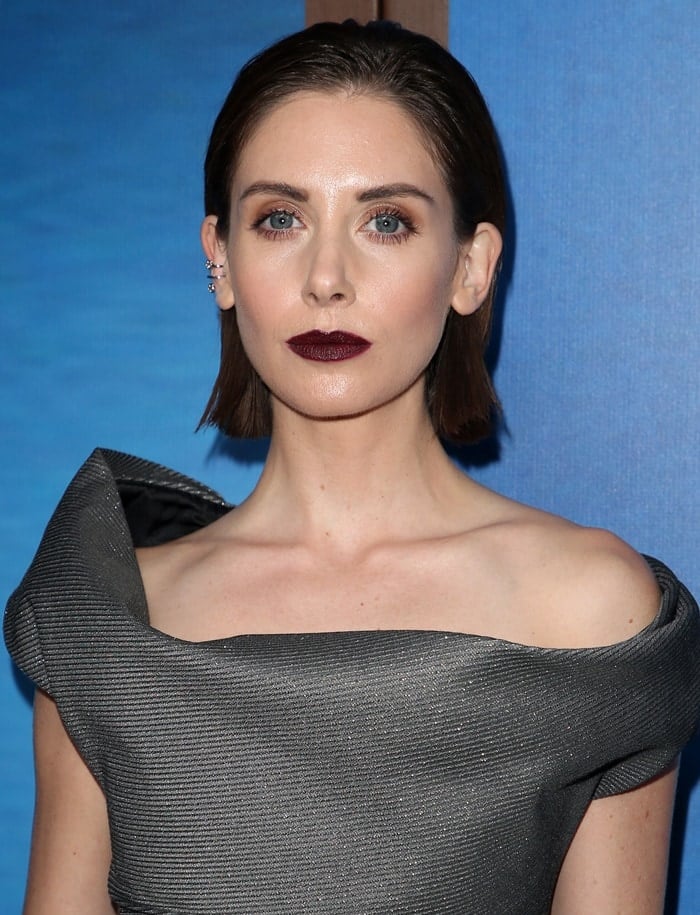 Alison Brie a gray off-the-shoulder Vivienne Westwood dress at the 2018 Writers Guild Awards at The Beverly Hilton Hotel in Beverly Hills, California, on February 11, 2018