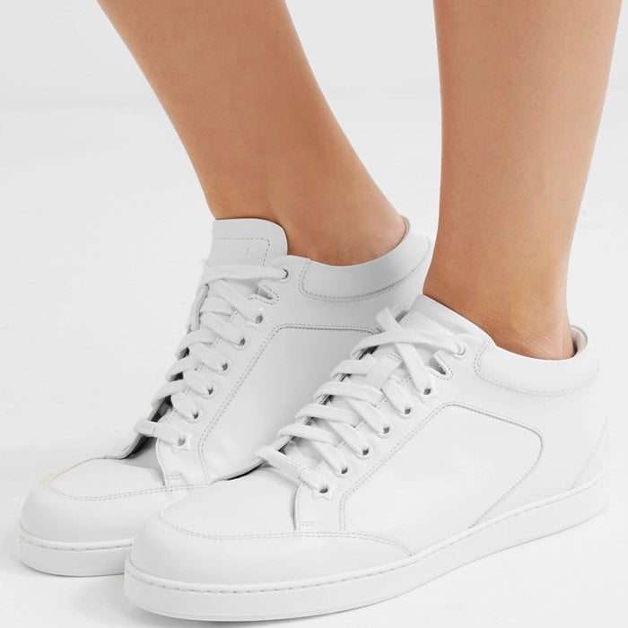 Jimmy Choo's 'Miami' sneakers are the perfect addition to your off-duty wardrobe. Made in Italy from smooth white leather, they have cushioned heel tabs, star-shaped eyelets and a gold logo plaque at the base of both soles.