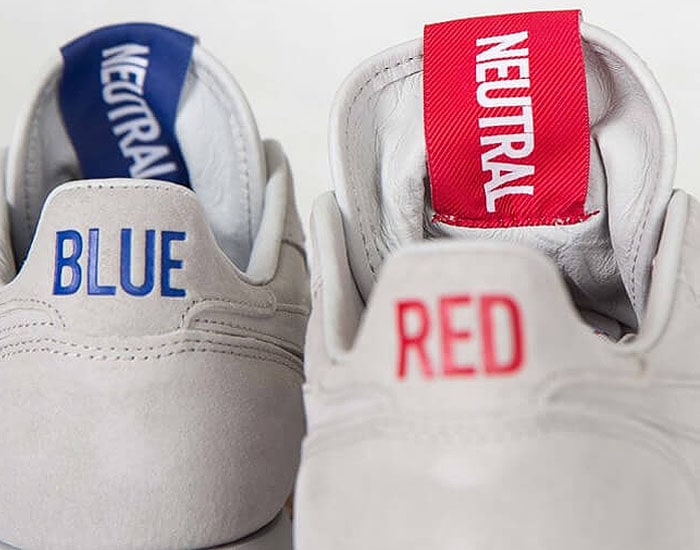 The "BLUE" and "RED" texts and corresponding "NEUTRAL" tongue tags on the Kendrick Lamar x Reebok 'Classic Leather' sneakers.