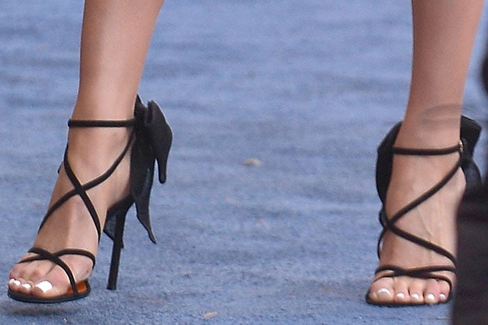 Olivia Culpo's feet in Walter De Silva bow-embellished strappy sandals