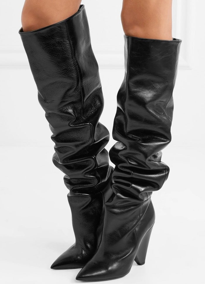 These 'Niki' boots are made from glossed-leather, set on the brand's signature cone heel and pointed at the toe