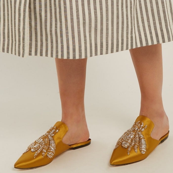Made from mustard satin, they are embroidered with the label's signature spider in metallic threads that are outlined by wispy chiffon fringing
