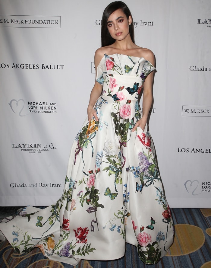 Sofia Carson in a strapless floral gown from Monique Lhuillier's Spring 2018 collection at the 2018 Los Angeles Ballet Gala at the Beverly Wilshire Four Seasons Hotel in Beverly Hills, California, on February 24, 2018