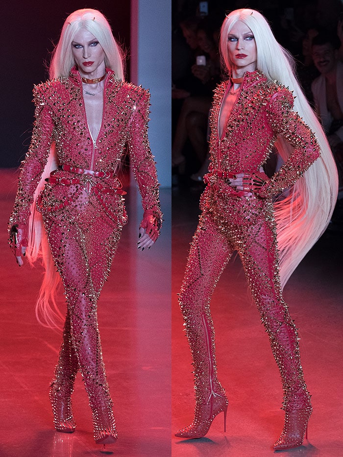 Phillipe Blond, one-half of the design duo The Blonds, wearing a spiked red leather zip bodysuit with Christian Louboutin spiked red leather booties.