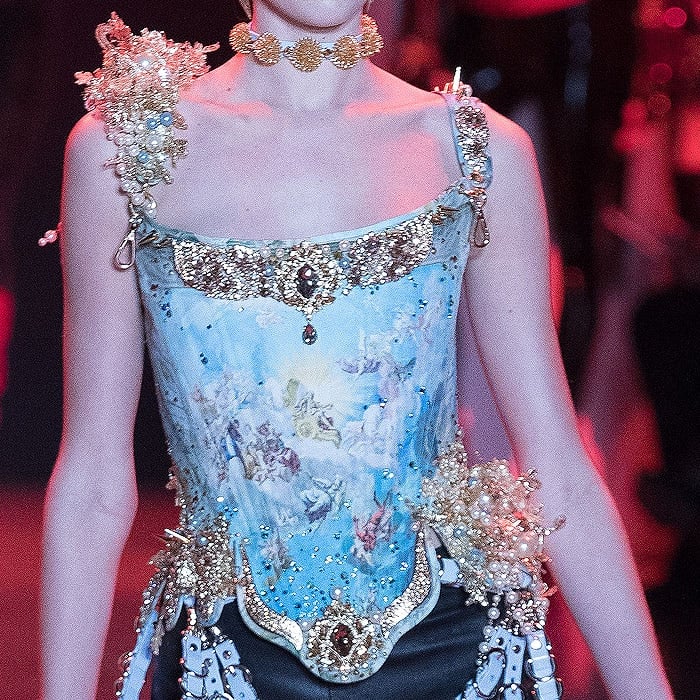 Corset featuring an angel painting print and gold-and-pearl embellishments.