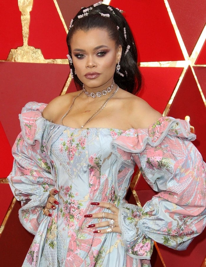 Andra Day wearing a floral pink and blue Zac Posen gown