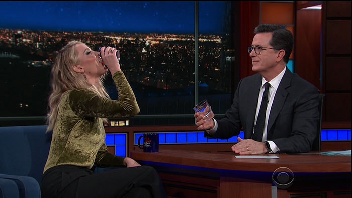 Jennifer Lawrence having a drink with "The Late Show" host Stephen Colbert.