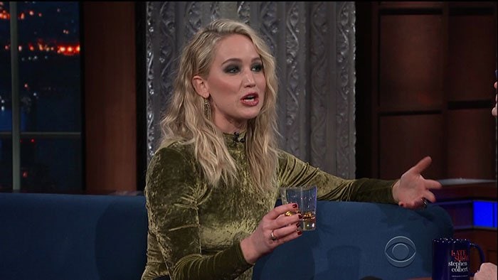 Jennifer Lawrence having a drink of rum on "The Late Show with Stephen Colbert."