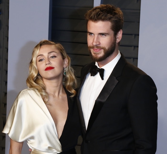 Miley Cyrus and her fiancé Liam Hemsworth at the 2018 Vanity Fair Oscar Party