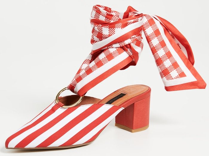 The red and white striped cotton 'Amber' mules have a red check ankle tie in silk looped around a central gold metal ring