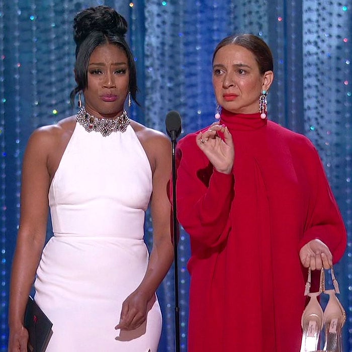 Tiffany Haddish and Maya Rudolph with their shoes off at the 2018 Oscars.