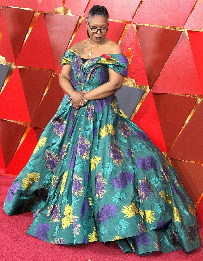 Whoopi Goldberg wearing a custom Christian Siriano ball gown with hiker boots.