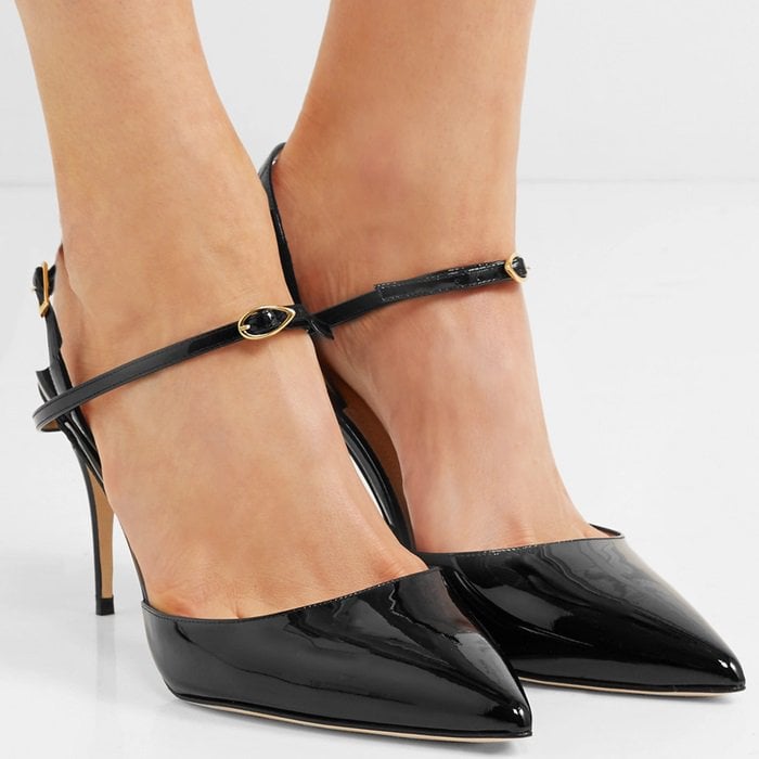 These black patent-leather 'Vittorio' slingback pumps feature the label's signature 'eye of the needle' detail