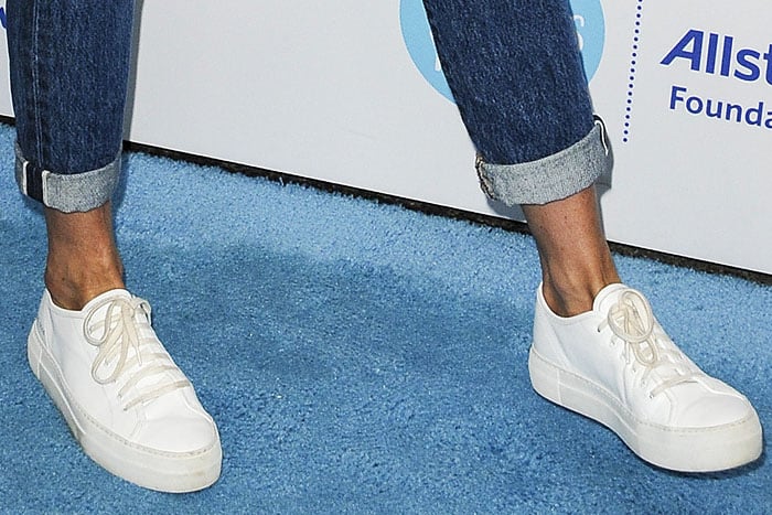Closeup of Jennifer Aniston's Common Projects 'Tournament' leather sneakers.