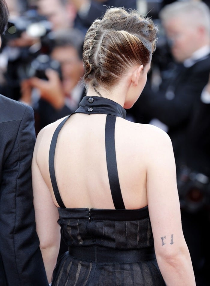 Kristen Stewart showing off the back of her classic LBD