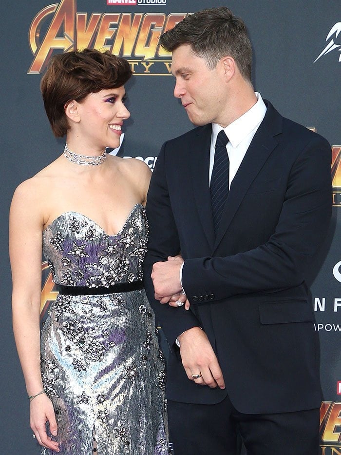 Scarlett Johansson and Colin Jost looking into each other's eyes.