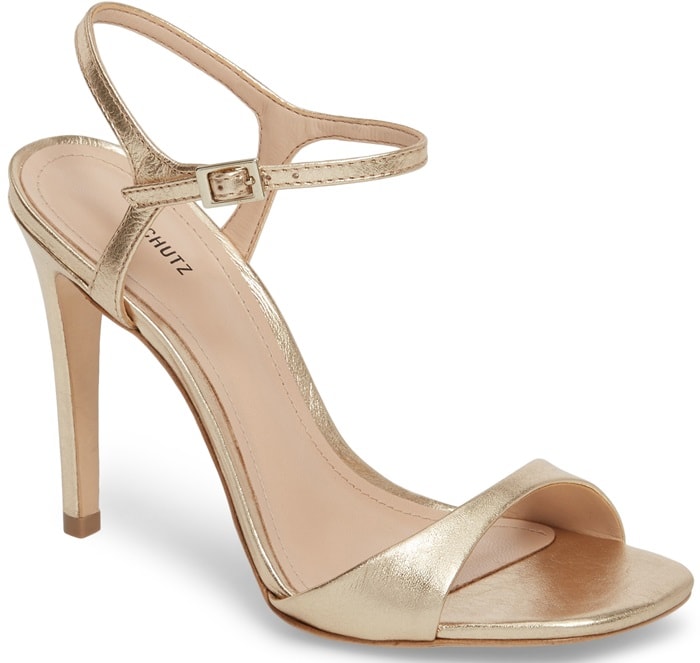 A slim ankle strap provides a graceful finishing touch for this essential sandal