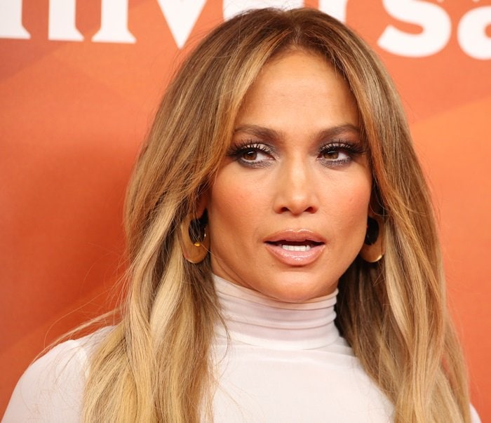 Jennifer Lopez showing off her statement earrings