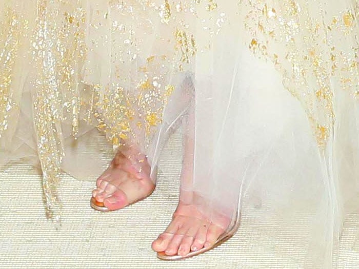 Kate Bosworth's feet in Manolo Blahnik 'Estro' clear-strap ankle-tie sandals.