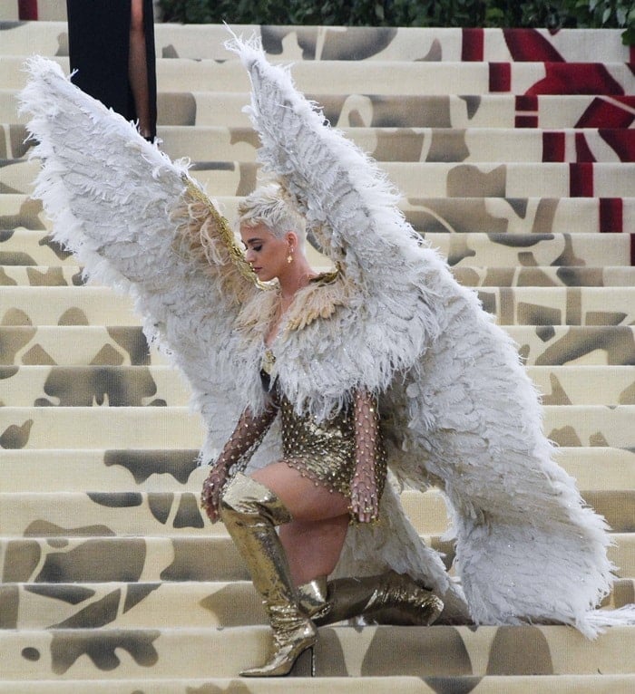 Katy Perry showing off her white dramatic feather wings