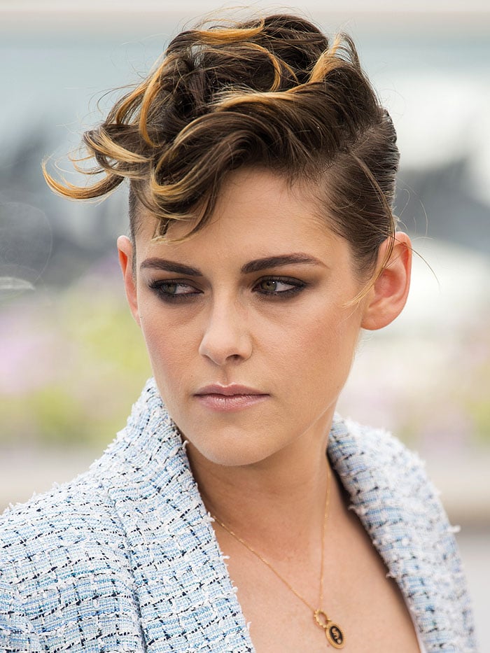 Kristen Stewart with a blonde-and-brown messy-top short hairdo.