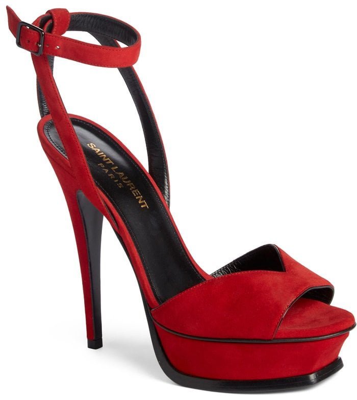 A beveled platform, sky-high heel and curvy strap at the vamp enhance the sultry attitude of this red Tribute sandal