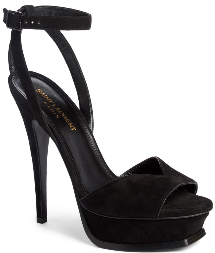 A beveled platform, sky-high heel and curvy strap at the vamp enhance the sultry attitude of this black Tribute sandal