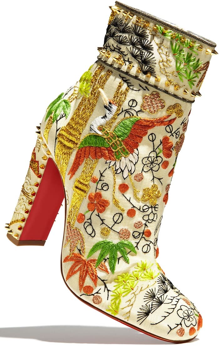 These exquisite Asian-inspired statement boots are designed with embroidered cranes, foliage and florals and feature a covered heel with spike studs, square toe, side zipper closure and the designer’s signature red lacquer sole