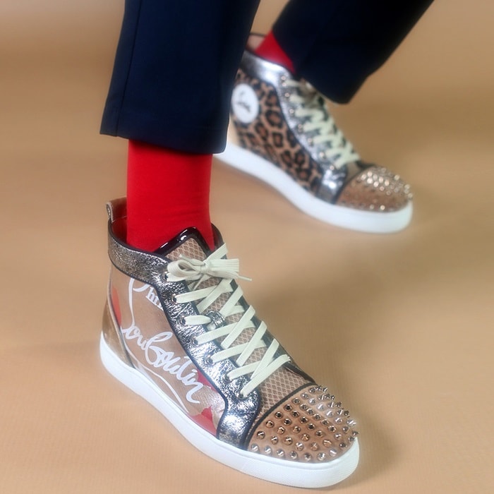 The sleek Lou Spikes high-top sneakers showcase Christian Louboutin's craftsmanship in a variety of textures and materials
