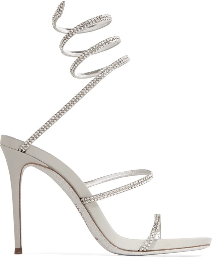 These silver leather 'Snake' sandals have shimmering crystal-embellished straps that coil around your ankle