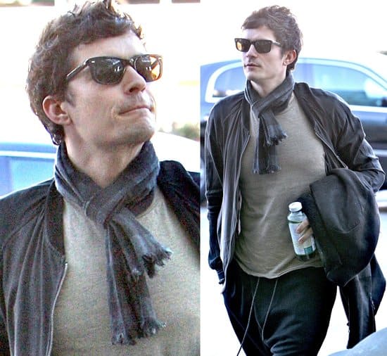 Seen at LAX Airport on November 25, 2009, Orlando Bloom effortlessly incorporates a scarf into his travel attire, demonstrating its versatility as both a fashion statement and a functional accessory