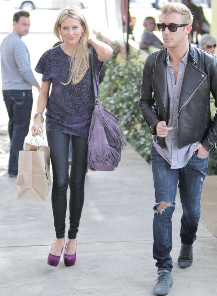 Stephanie Pratt totes an elegant Gerard Darel fringe hobo bag