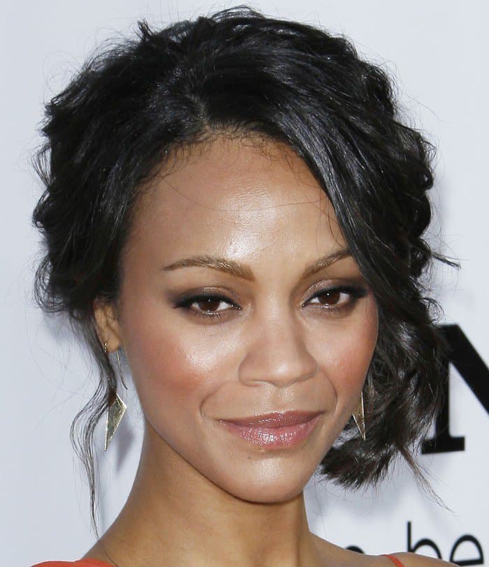Zoe Saldana radiates elegance at the LA premiere of 'Death at a Funeral' with her stunning makeup and poised presence, showcasing her impeccable taste in fashion