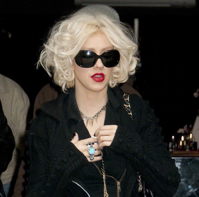 Christina Aguilera wears a Stephen Webster sterling silver Superstud necklace and Prada Spr 08ls sunglasses