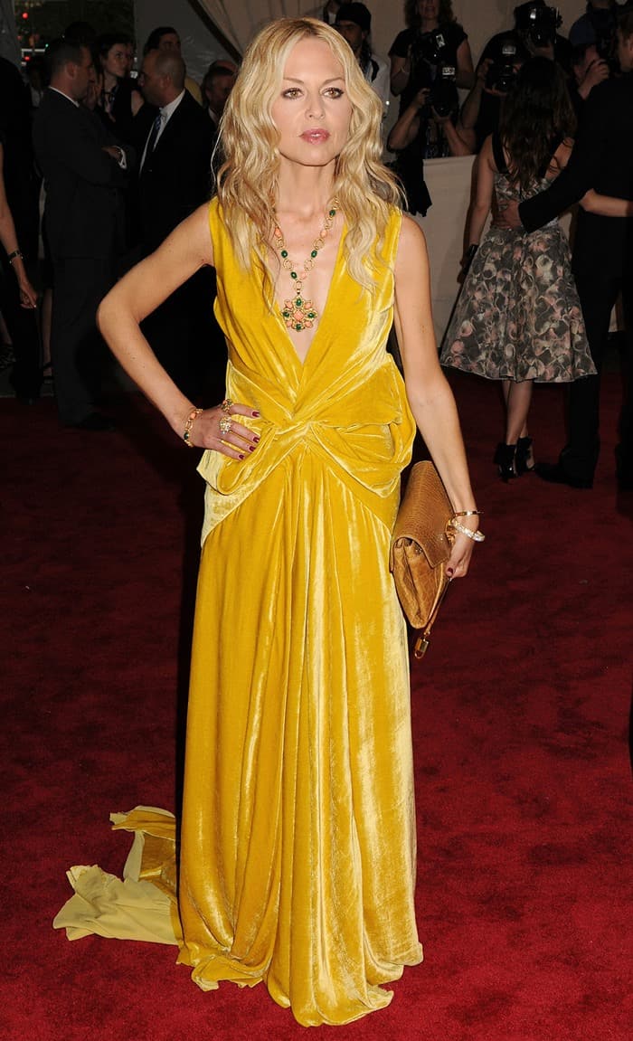 Rachel Zoe's daring fashion choice at the MET Gala 2010: Clad in a striking yellow-gold velvet gown by Marc Jacobs, the celebrity stylist makes a bold statement at The Metropolitan Museum of Art's 'American Woman: Fashioning a National Identity' exhibition opening in New York City on May 3, 2010
