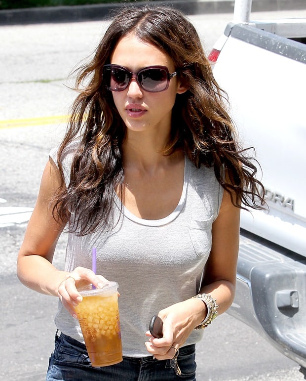 On a sunny June 18, 2010, Jessica Alba enjoys a refreshing iced beverage while indulging in a shopping spree at the Bel Bambini baby boutique on Robertson Boulevard