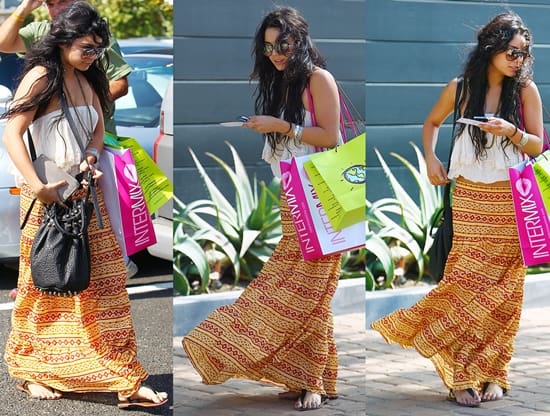 Vanessa Hudgens in a boho-look dress texting on her Blackberry cellphone