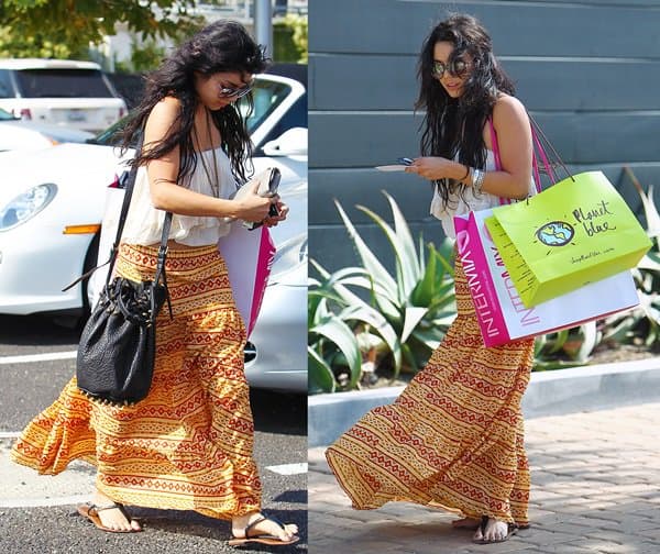 Vanessa Hudgens in a boho-look dress texting on her Blackberry cellphone and looking quite nervous as she continually bites her nails while she shopped at Cross Creek in Malibu