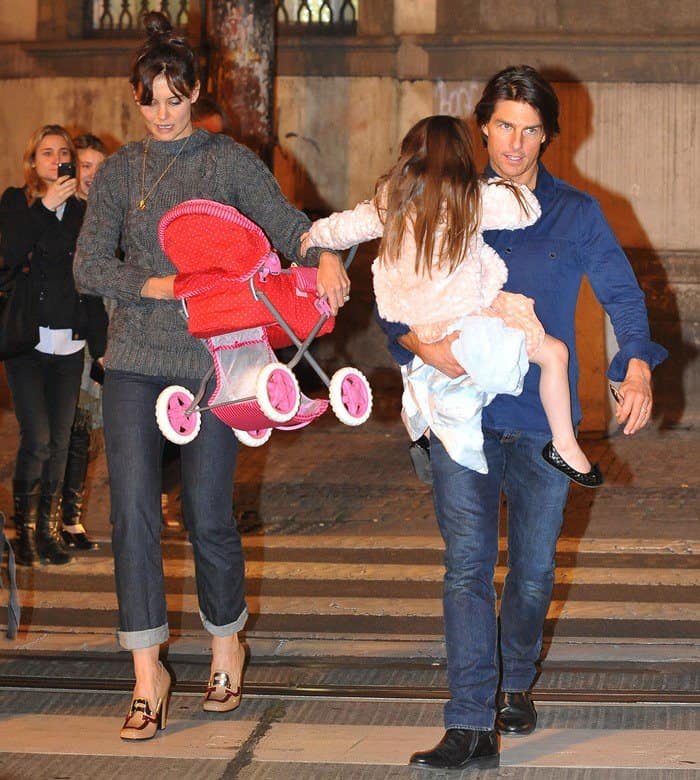 Tom Cruise with wife Katie Holmes and daughter Suri returning to their hotel after dining out in Prague