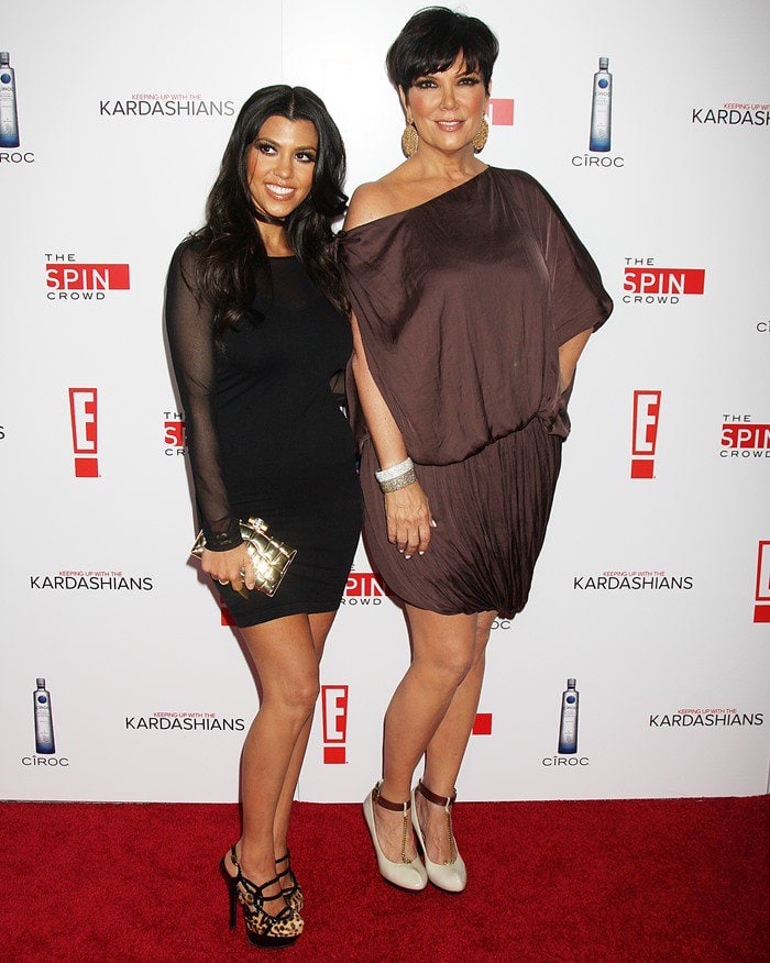 Kourtney Kardashian and her mother, Kris Jenner, pose for photos on the red carpet