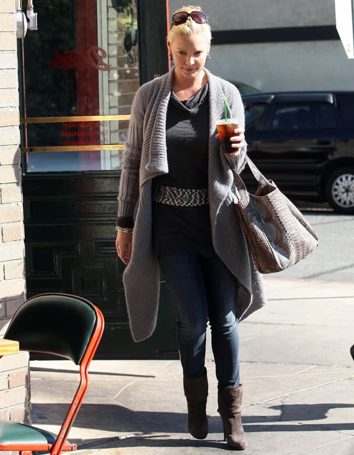 Captured on October 11, 2010, Katherine Heigl exudes autumnal charm as she departs Little Dom's in Los Feliz, perfectly accessorized with a chic, oversized wrap cardigan
