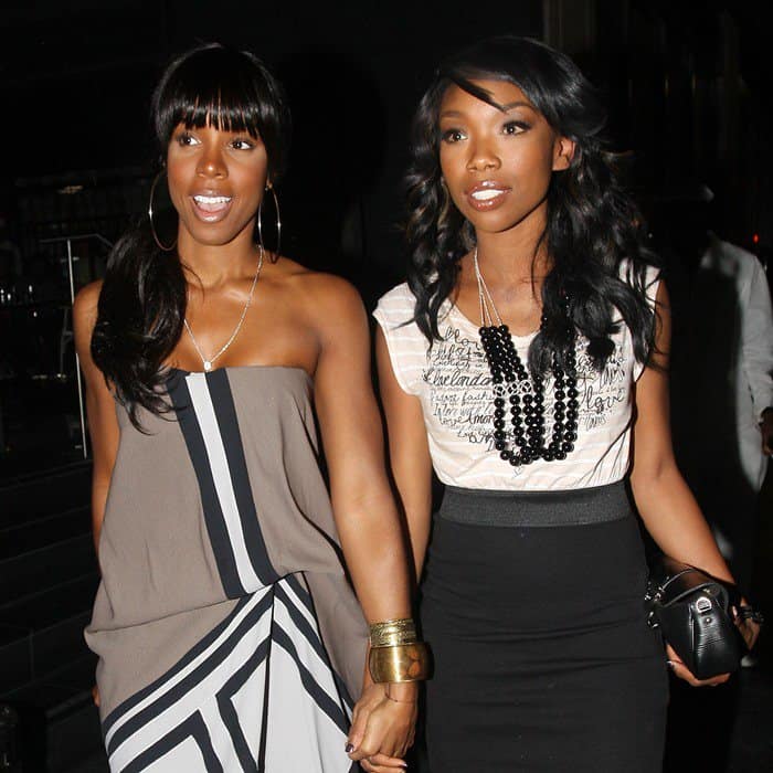 Joined by Brandy, Kelly Rowland turns heads in a BCBGMAXAZRIA geometric colorblock dress at Katsuya in Los Angeles