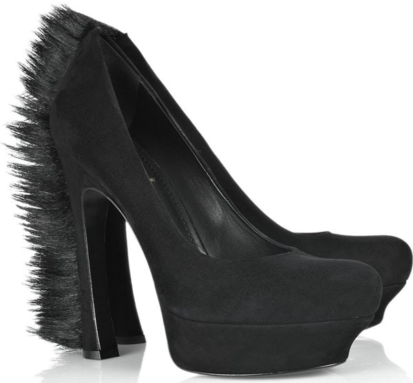 The black suede Yves Saint Laurent "Palais 105" pumps feature a stacked sole and goat hair fringe